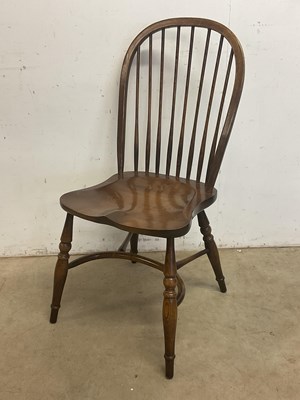Lot 661 - A contemporary ash and elm high hoop back...