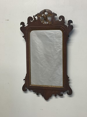 Lot 648 - A mahogany fretwork wall mirror, height 70cm.