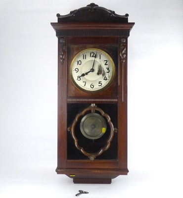 Lot 75 - An early 20th century oak cased regulator wall clock