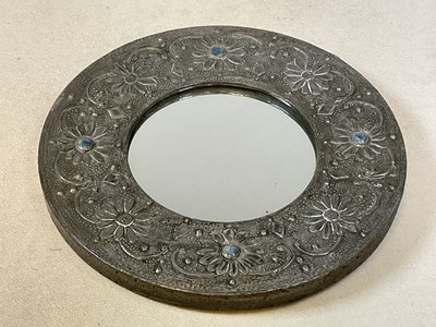 Lot 164 - An Arts and Crafts hammered pewter circular...