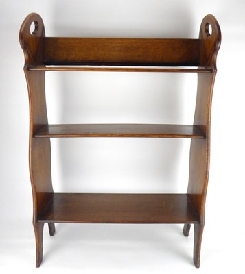 Lot 19 - An Arts & Crafts style oak floorstanding bookcase