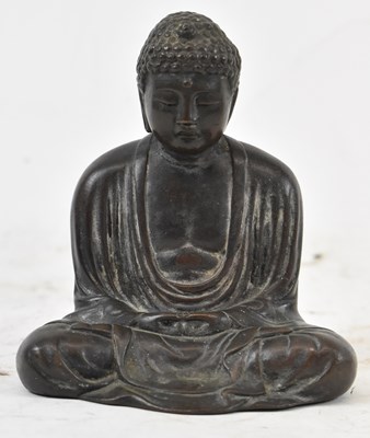 Lot 543 - A Chinese bronze figure of a seated Buddha,...