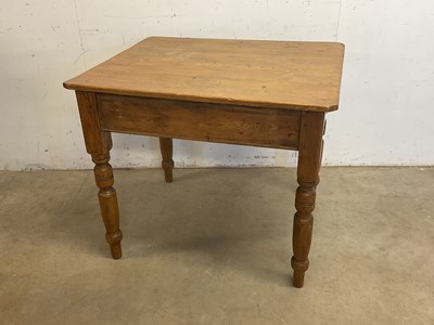 Lot 599 - A pine kitchen table of small proportions with...