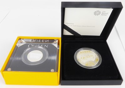 Lot 669 - THE ROYAL MINT; two Queen (Rock band)...