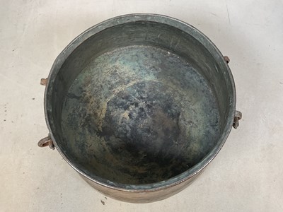 Lot 156 - A beaten copper tapering circular vessel with...