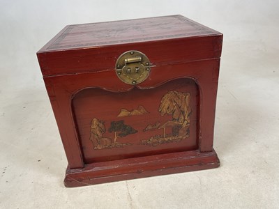 Lot 605 - A Chinese rectangular red lacquered chest....