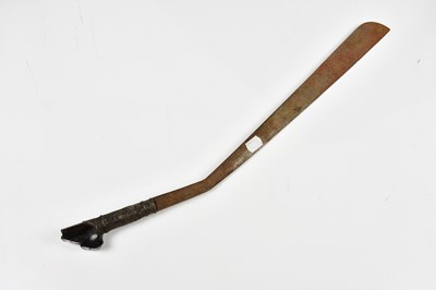 Lot 715 - An ethnic short sword with a distinct curve...