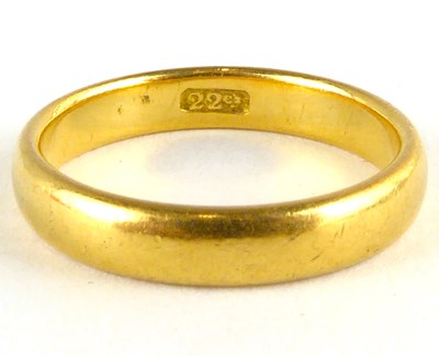 Lot 783 - A 22ct gold thin wedding band, size L, approx....