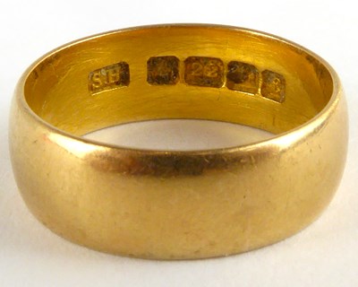 Lot 782 - A 22ct gold wide wedding band, size N/O,...