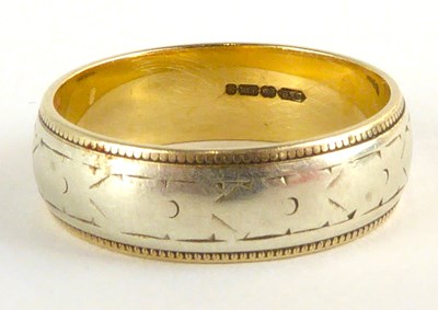 Lot 826 - A 9ct gold wedding band with central white...