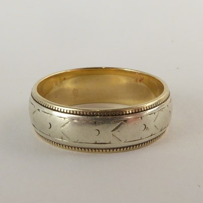 Lot 826 - A 9ct gold wedding band with central white...