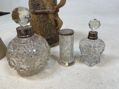 Lot 172 - A cut glass globular perfume bottle with...