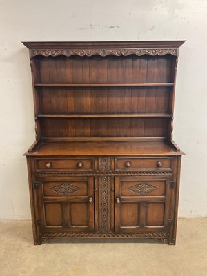 Lot 559 - A reproduction oak dresser with boarded plate...