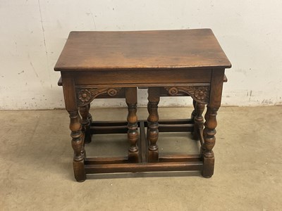 Lot 634 - A reproduction nest of three oak occasional...