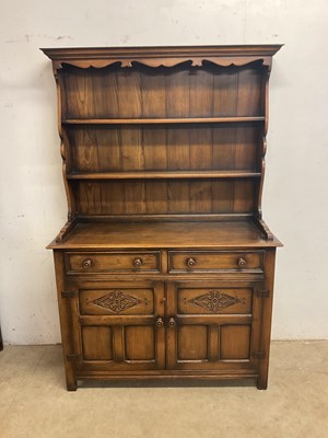Lot 560 - A reproduction oak dresser with boarded plate...