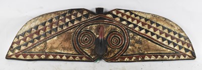 Lot 510 - TRIBAL ART; a carved wooden Mou Shield, length...