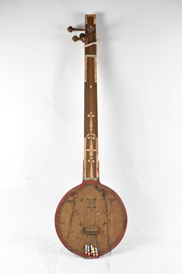 Lot 326 - A carved wooden sitar, length 112cm.