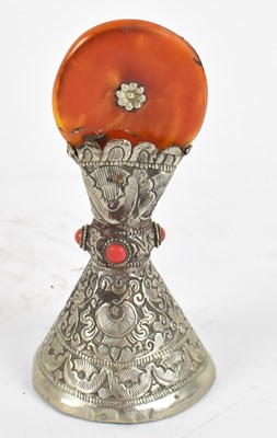 Lot 526 - A Tibetan white metal, amber and gem decorated...