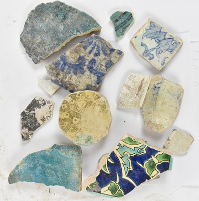 Lot 199 - A collection of ancient Eastern tile fragments.