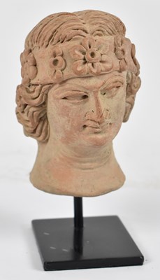 Lot 195 - After the Antique; a terracotta bust on stand,...