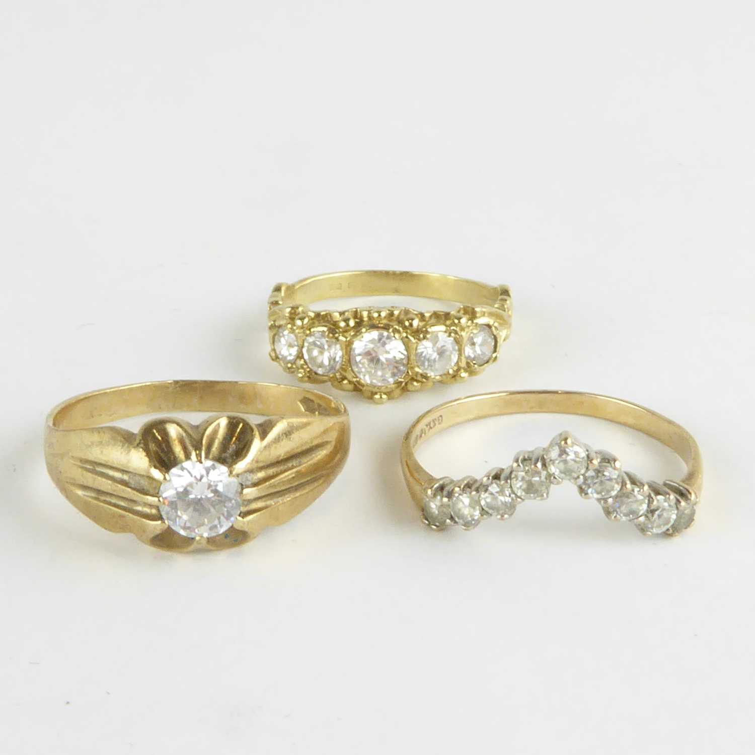 Lot 809 - Three 9ct gold dress rings with white stones,...