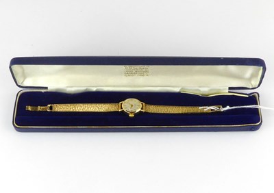 Lot 956 - GARRARD; a ladies' vintage 9ct gold wristwatch,...