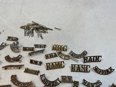Lot 125 - A group of original military shoulder titles...