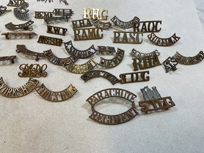 Lot 125 - A group of original military shoulder titles...