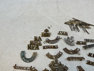 Lot 125 - A group of original military shoulder titles...