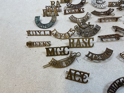 Lot 125 - A group of original military shoulder titles...