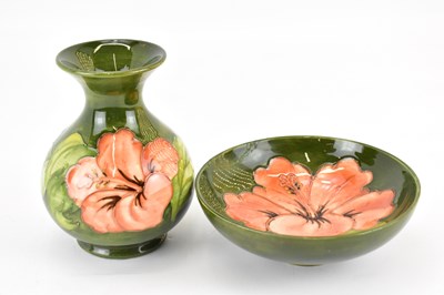 Lot 262 - MOORCROFT; a Hibiscus pattern short vase,...