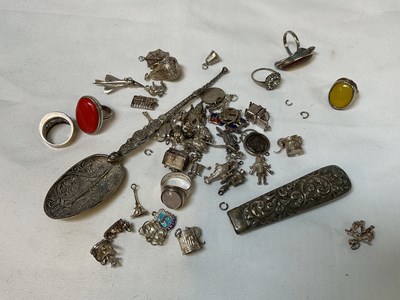 Lot 397 - A collection of silver charms, six silver...