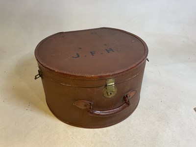 Lot 142 - A large vintage leather trimmed hat box...