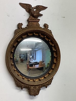 Lot 558 - A French Regency style gilded circular convex...