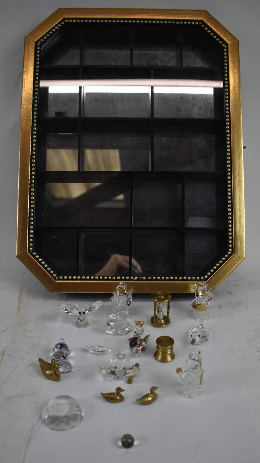 Lot 253 - A modern wall mounted display case enclosing a...