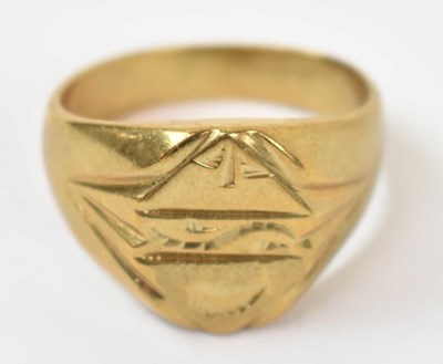 Lot 793 - A yellow metal gentlemen's ring, stamped 18k,...