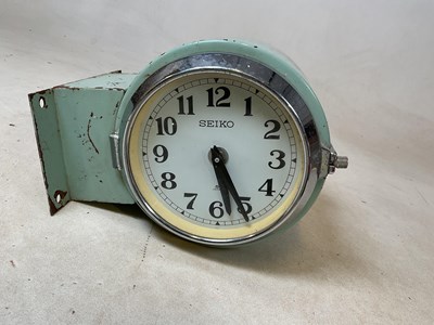 Lot 30 - A double sided Seiko wall mounted clock with...