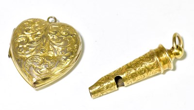Lot 356 - A yellow metal engraved whistle with ring loop...