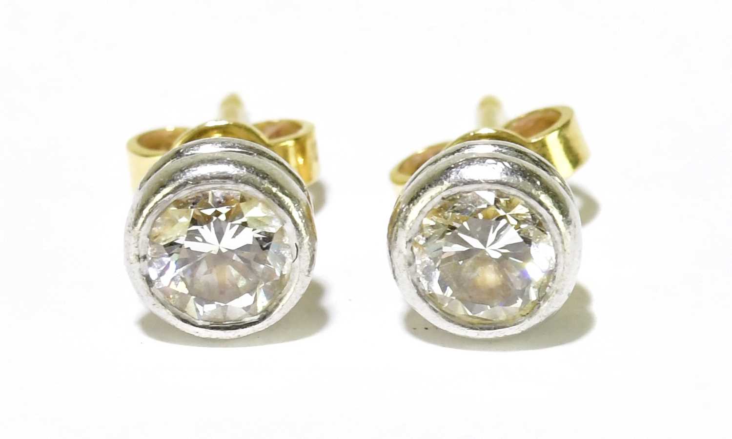 Lot 317 - A pair of 18ct yellow and white gold collet