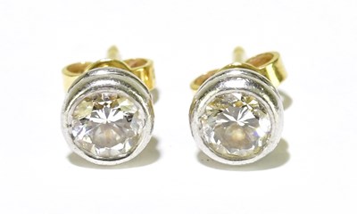 Lot 317 - A pair of 18ct yellow and white gold collet...