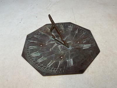 Lot 4 - A 19th century octagonal copper sun dial with...