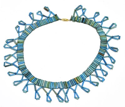 Lot 246 - An Egyptian late New Kingdom turquoise faience...