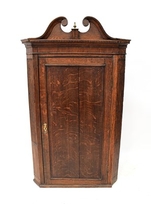 Lot 89 - An 18th century Scottish oak corner cabinet...