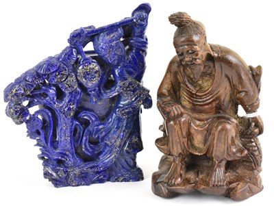 Lot 323 - A Chinese lapis lazuli carved figure of a lady...