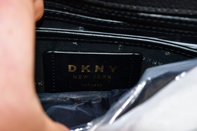 Lot 672 - DKNY; an unused with original tags black...