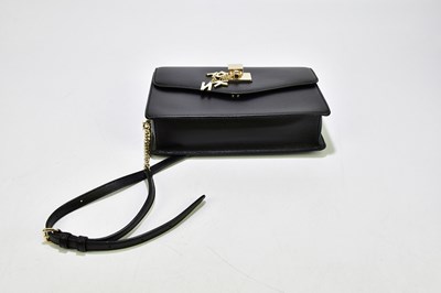 Lot 672 - DKNY; an unused with original tags black...