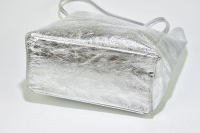 Lot 718 - A silver leather large tote bag with two top D-...