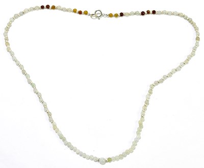 Lot 282 - A jade bead necklace with white metal spacers...