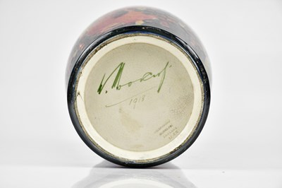 Lot 64 - WILLIAM MOORCROFT; a large vase of inverted...
