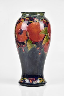 Lot 64 - WILLIAM MOORCROFT; a large vase of inverted...